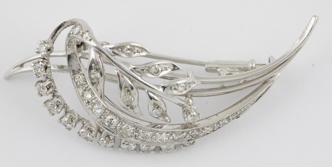 18k white gold brooch set with brilliant and single-cut diamonds...
