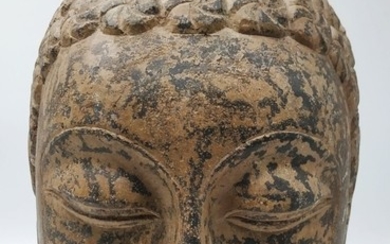 A old Buddha's head made out of basalt