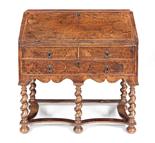 A William and Mary walnut and seaweed marquetry bureau on a later stand