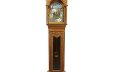 A colonial revival oak tall case clock circa 1900...