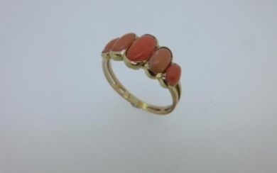 A five stone coral ring