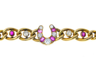 A late Victorian gold, diamond and ruby horseshoe bracelet. View more details