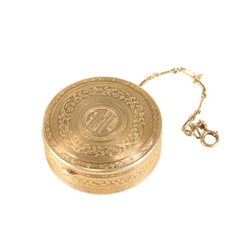 A 14CT GOLD PILL BOX with engraved and embossed floral decor...
