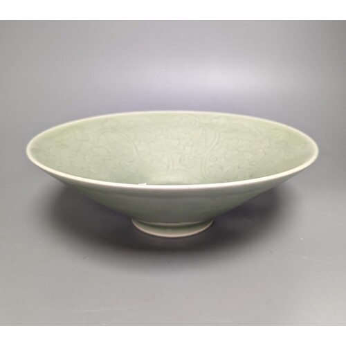 A 19th century Chinese sgraffito celadon glazed dish, diamet...