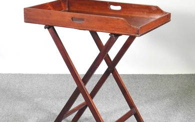 A 19th century mahogany butler's tray, on a folding stand...