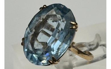 A 9ct gold and blue topaz ring.
