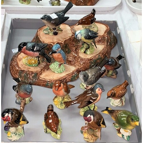 A Beswick bird stand and a large collection of Beswick birds...