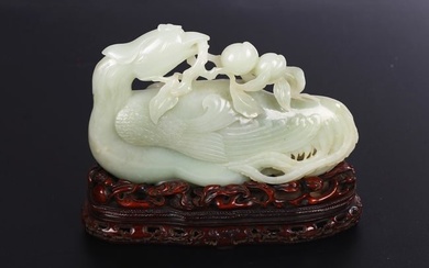 A CHINESE WHITE JADE CARVED FIGURE OF PHOENIX