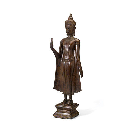 A COPPER ALLOY STANDING FIGURE OF A CROWNED BUDDHA