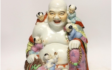 A Chinese enamelled porcelain group of laughing Budai with c...