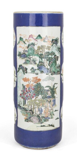 A Chinese porcelain cylindrical famille verte stick stand, 19th century, decorated with two large panels, one painted with a landscape, the other with flowers and rockwork, interspersed with six smaller panels of flowers and mythical beasts, all on...