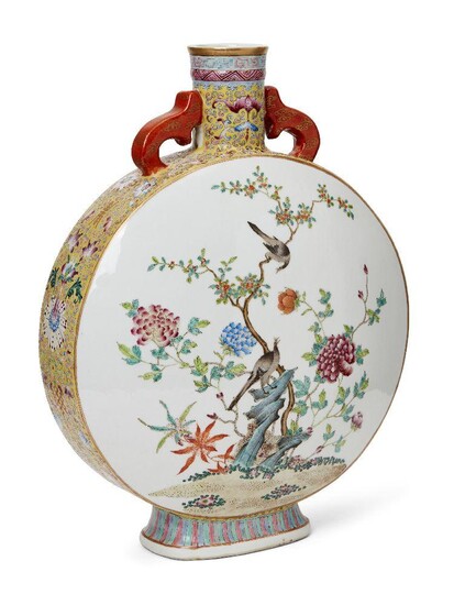 A Chinese porcelain moon flask, Republic period, painted in famille rose enamels with a group of geese standing on a windswept bank bearing flowering daisies and reeds, two geese diving beneath the surface of the water as a flowering lotus bloom...