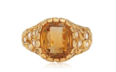 A DIAMOND AND CITRINE INTAGLIO RING The openwork scrolled r...