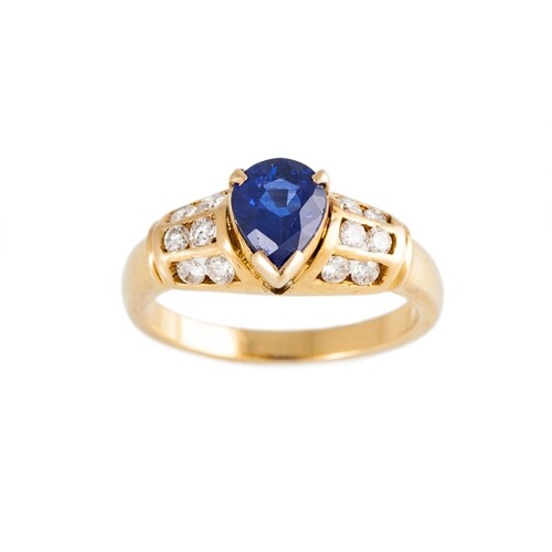 A DIAMOND AND SAPPHIRE RING, the pear shaped sapphire to cha...