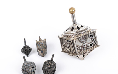 A GROUP OF STERLING SILVER DREIDELS