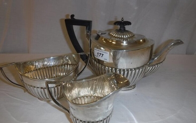 A George V silver three piece tea set with...