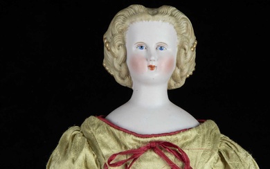 A German bisque shoulder-head doll with elaborate hair