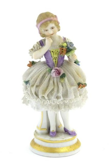 A German porcelain figure of a flower girl with a