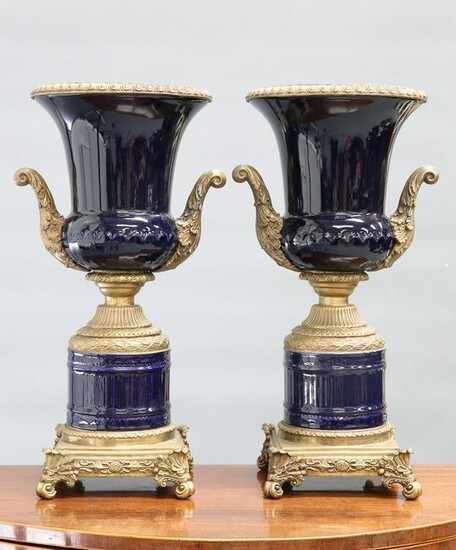 A LARGE PAIR OF GILT-METAL MOUNTED BLUE-GLAZED URNS