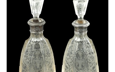 A NEAR PAIR OF 19TH CENTURY SILVER TOPPED CUT GLASS DECANTER...