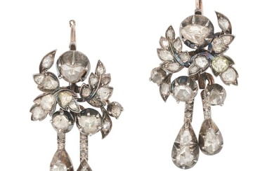 A PAIR OF ANTIQUE DIAMOND DROP EARRINGS in yellow gold and silver, each designed as flowers with two