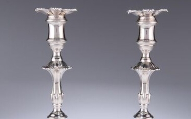 A PAIR OF GEORGE III CAST SILVER CANDLESTICKS...