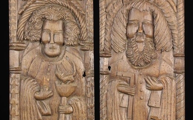 A Pair of Boldly Carved Oak Panel...