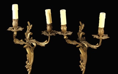 A Pair of Louis XV Style Gilt Bronze Twin-branch Wall Sconces cast and entwined stems of crested aca