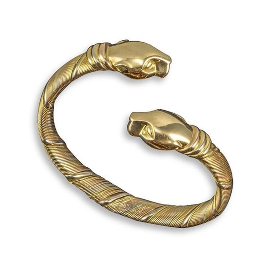 A 'Panthere' tri-colour gold bangle by Cartier, of...