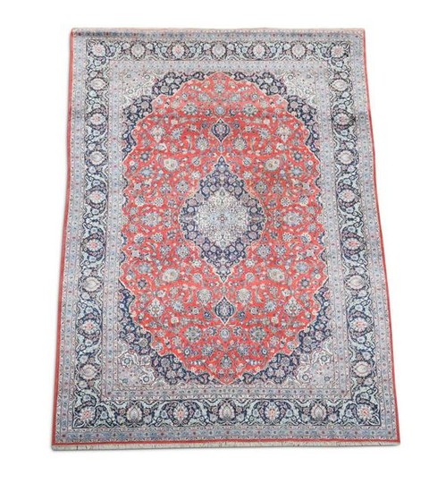 A Tabriz madder ground carpet