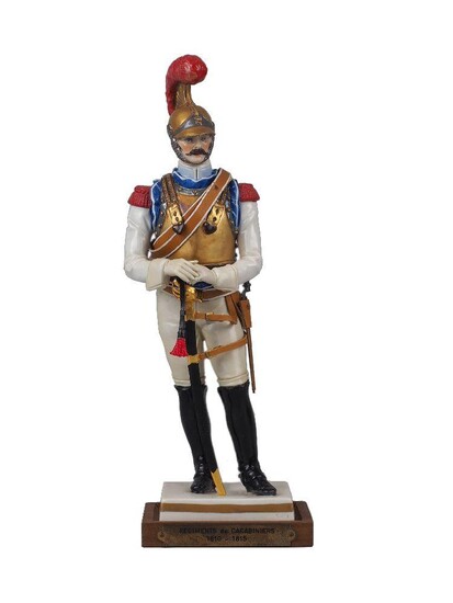 A Van Gerdinge / Sitzendorf porcelain figure of an 1812 Carabinier-à-Cheval of the Regiment de Carabiniers, 20th century, bearing factory marks to the underside, the figure with accompanying saber, on custom wood base with brass plaque, original...