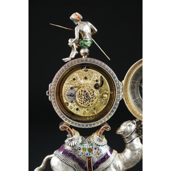 A Viennese silver table clock with rock crystal case