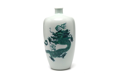 A blue and white and polychrome porcelain vase painted overall with a pattern of green dragons