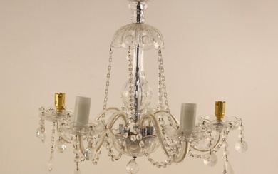 A cut glass chandelier, 20th century, the domed top leading ...