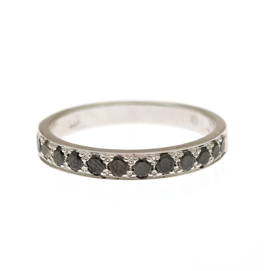 A diamond ring set with numerous brilliant-cut black diamonds, mounted in 18k rhodium plated gold. W. 3 mm. Size 55.