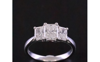 A fine diamond three ring set in platinum with a copy of a G...