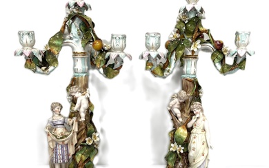 A fine pair of Sitzendorf porcelain figural candelabra, 19th century, each with a removable four