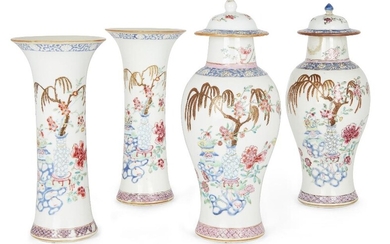 A garniture of four Chinese famille rose vases, Qianlong period, comprising of two flared vases painted with 'hundred treasures' to the body below a band of chrysanthemum and stylised scrolls, two lidded vases of baluster form with tapered foot and...