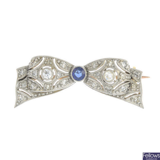 A mid 20th century platinum and gold sapphire and vari-cut diamond bow brooch.