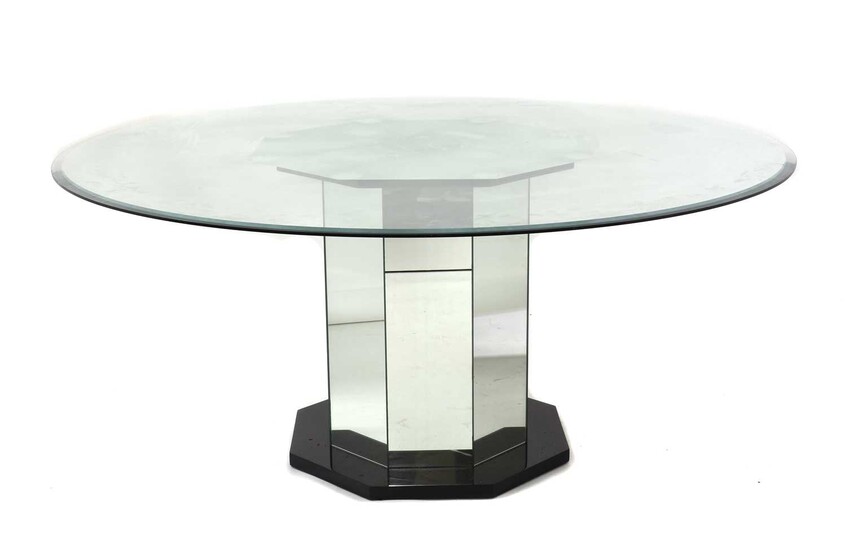 A mirrored glass dining table