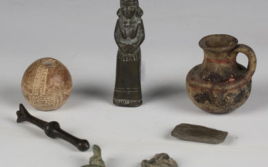 A mixed group of antiquities, including a small burnished pot, two fragments, detailed 'Petra