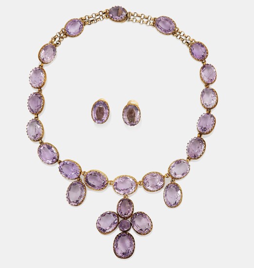 A necklace and a pair of earrings in silver set with amethysts