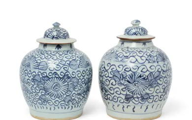 A pair of Chinese blue and white 'peonies' jars and covers Qing...