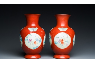 A pair of Chinese coral-ground famille rose vases with medal...