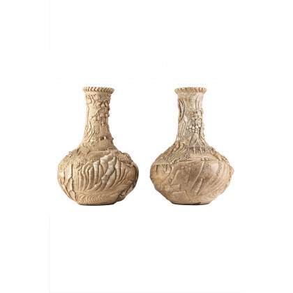 A pair of "Ge" tipe glaze vases, relief decorated in sculptural way with figures, pagodas and shrubs (defects and restorations)...