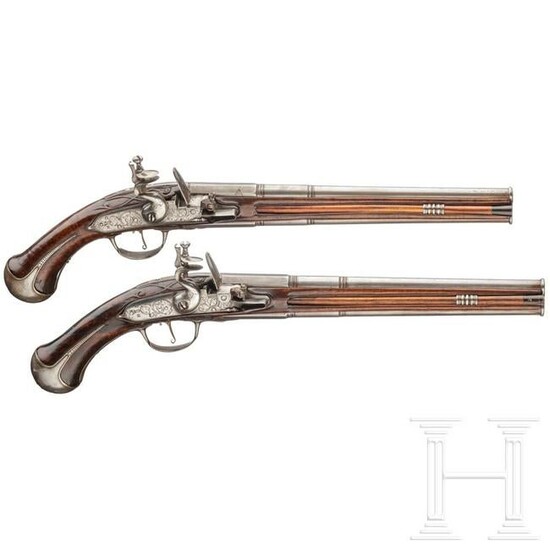 A pair of German over-and-under flintlock pistols
