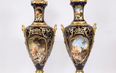 A pair of exceptionally tall ornamental vases of cobalt blue porcelain and gilt brass, decorated with medallions with mythical decor, Sèvres style, 20th century