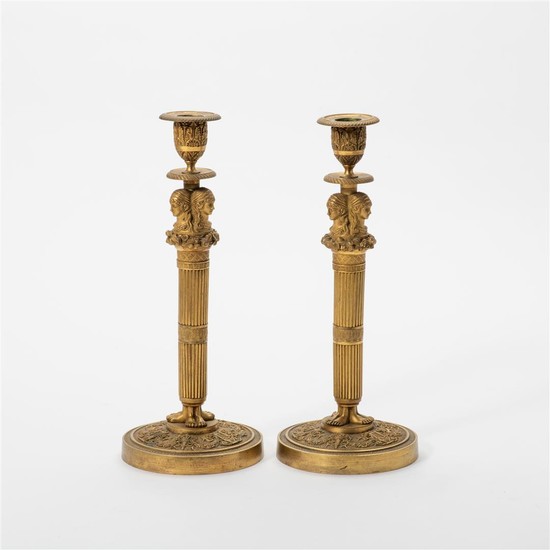 A pair of gilt-bronze Empire-style candlesticks France, 19th/20th...