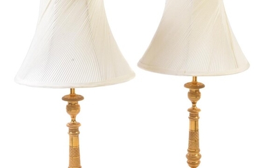 A pair of gilt metal candlestick table lamps in Charles X style