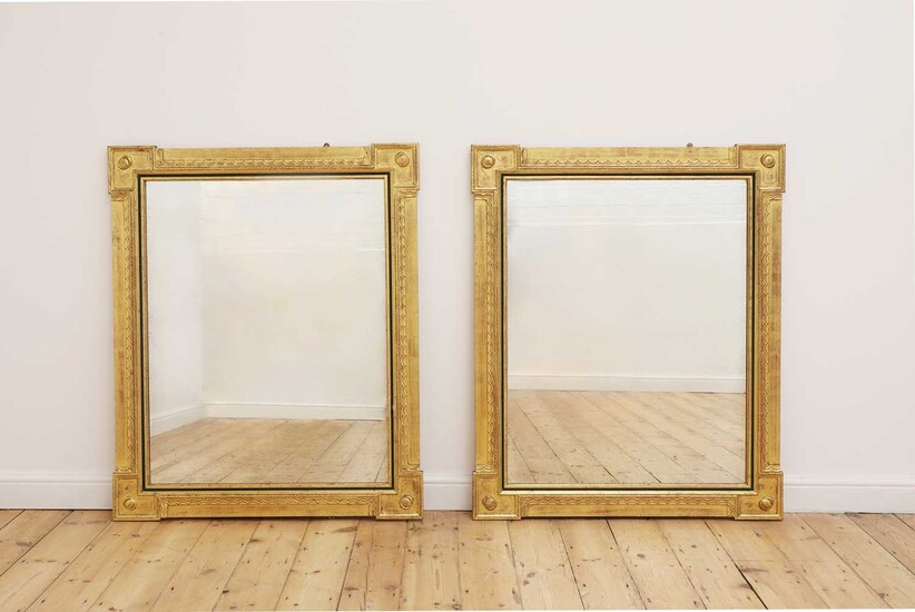 A pair of giltwood and ebonised mirrors